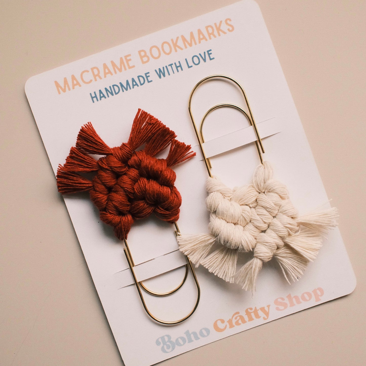 Two macrame bookmarks on a card with 'Boho Crafty Shop' branding.